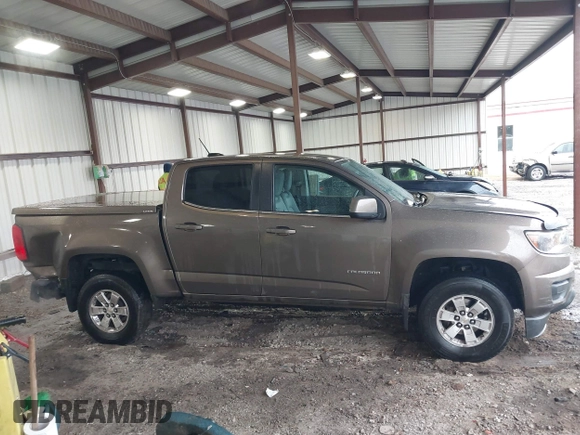 2015 Chevrolet Colorado 2WD WT z VIN 1GCGSAE34F1270479, wystawiony jako IAAI lot #41768612 z przebiegiem 158 984 mil mil oraz . Historia ofert i sprzedaży dostępna na DreamBid. Obrazek 13.