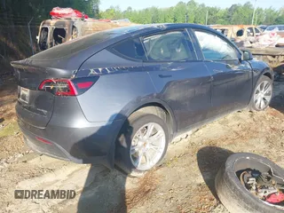 2023 Tesla Model Y Long Range with VIN 7SAYGDEE1PF647841, listed as a IAAI auction lot 41156390 with 33,473 mi miles. Bid and sale history available at carsss.com. Image 4.