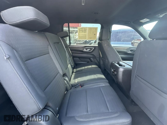 2021 Chevrolet Suburban LS with VIN 1GNSCBKD7MR301059, listed as a Copart auction lot 77436554 with 54,279 mi miles and Clean Title. Bid and sale history available at DreamBid. Image 6.