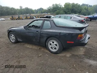 1987 Porsche 944 z VIN WP0AB0946HN474232, wystawiony jako Copart lot #64654684 z przebiegiem 87 126 mil mil oraz Szkoda całkowita • Salvage title. Historia ofert i sprzedaży dostępna na DreamBid. Obrazek 2.