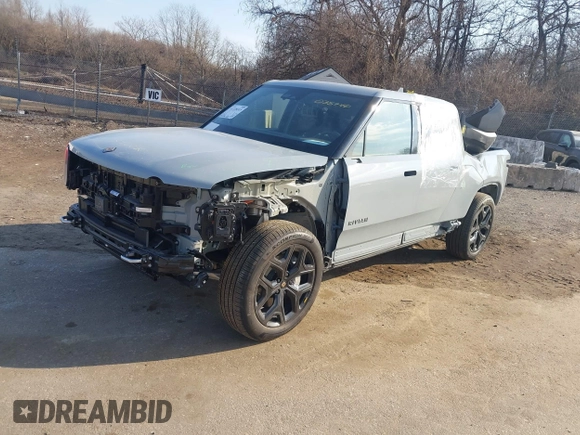 2025 Rivian R1T Adventure z VIN 7FCTGBAAXSN035740, wystawiony jako IAAI lot #41728515 z przebiegiem 3 773 mil mil oraz . Historia ofert i sprzedaży dostępna na DreamBid. Obrazek 2.