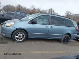 2005 Toyota Sienna XLE with VIN 5TDBA22CX5S039921, listed as a IAAI auction lot 41812339 with 245,111 mi miles and . Bid and sale history available at DreamBid. Image 14.