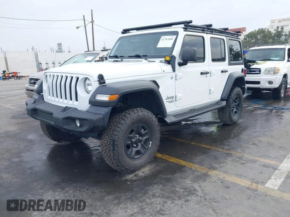 2018 Jeep Wrangler Unlimited Sport with VIN 1C4HJXDN0JW265823, listed as a IAAI auction lot 41707684 with 60,072 mi miles and . Bid and sale history available at DreamBid. Image 2.