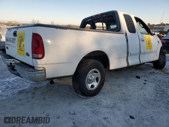 2003 Ford F-150 XL with VIN 1FTRX17W63NA12390, listed as a Copart auction lot 42127405 with 282,656 mi miles and Salvage Title. Bid and sale history available at carsss.com. Image 3.