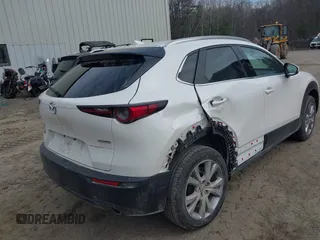 2021 Mazda CX-30 Premium with VIN 3MVDMBDM8MM216520, listed as a IAAI auction lot 41848596 with 60,353 mi miles and . Bid and sale history available at DreamBid. Image 6.