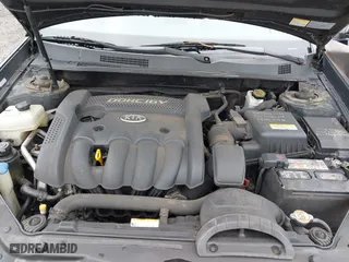 2007 Kia Optima LX with VIN KNAGE123175133499, listed as a IAAI auction lot 41958955 with 132,480 mi miles. Bid and sale history available at carsss.com. Image 10.