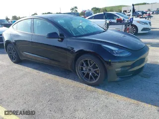 2023 Tesla Model 3 with VIN 5YJ3E1EA4PF433774, listed as a IAAI auction lot 42019223 with 33,265 mi miles. Bid and sale history available at carsss.com. Image 1.