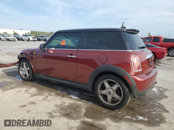 2007 MINI Hardtop with VIN WMWMF33577TT52975, listed as a Copart auction lot 53909855 with 127,325 mi miles and Salvage title. Bid and sale history available at DreamBid. Image 2.