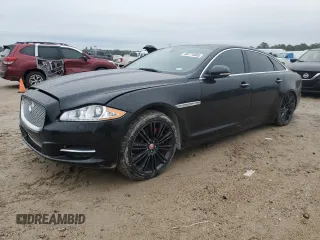 2014 Jaguar XJ with VIN SAJWA2GZ2E8V64993, listed as a Copart auction lot 88774965 with 0 mi miles and Salvage Title. Bid and sale history available at carsss.com. Image 1.