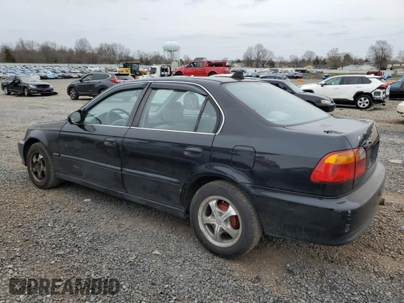 1999 Honda Civic LX with VIN 2HGEJ6677XH585273, listed as a Copart auction lot 51164635 with 184,874 mi miles and Salvage Title. Bid and sale history available at DreamBid. Image 2.
