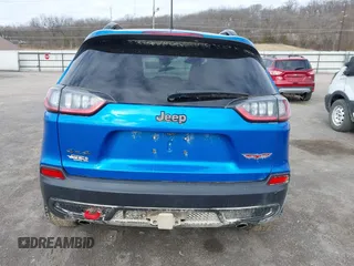 2022 Jeep Cherokee Trailhawk z VIN 1C4PJMBX1ND539319, wystawiony jako IAAI lot #41811178 z przebiegiem 49 922 mil mil oraz . Historia ofert i sprzedaży dostępna na DreamBid. Obrazek 17.