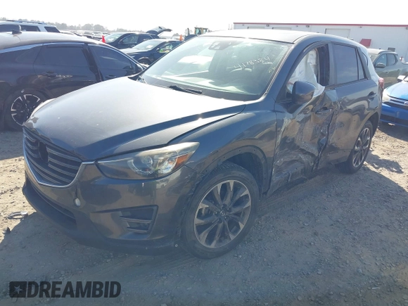 2016 Mazda CX-5 Grand Touring with VIN JM3KE4DY8G0823567, listed as a IAAI auction lot 41784384 with 143,836 mi miles and . Bid and sale history available at carsss.com. Image 17.