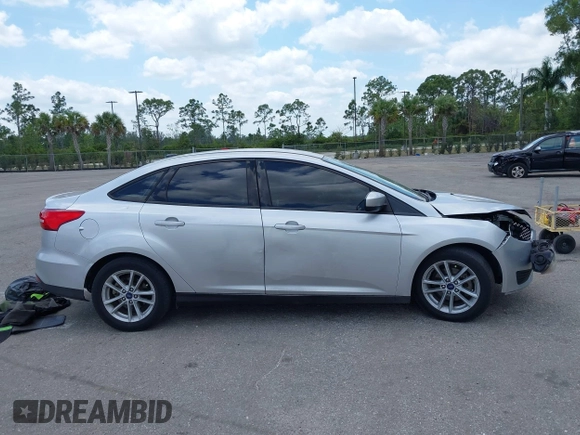 2018 Ford Focus SE z VIN 1FADP3FE9JL241661, wystawiony jako IAAI lot #42103513 z przebiegiem 117 003 mil mil oraz . Historia ofert i sprzedaży dostępna na DreamBid. Obrazek 13.