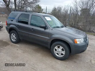 2003 Ford Escape XLT Popular 2 with VIN 1FMYU93103KA39840, listed as a IAAI auction lot 41966605 with 141,321 mi miles. Bid and sale history available at carsss.com. Image 1.