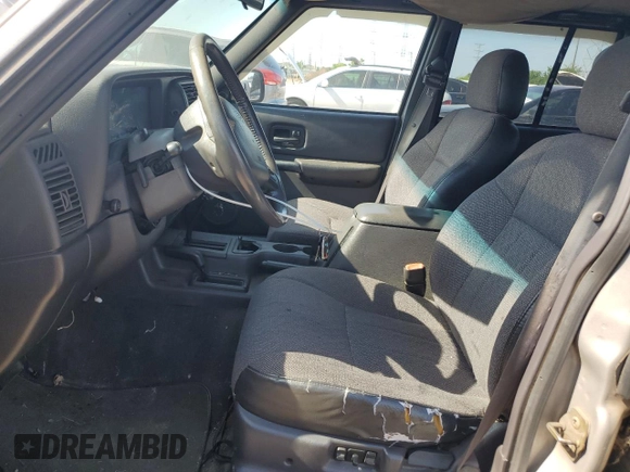 2001 Jeep Cherokee Sport z VIN 1J4FF58S61L540796, wystawiony jako Copart lot #62384895 z przebiegiem 209 294 mil mil oraz Czysty tytuł • Clean title. Historia ofert i sprzedaży dostępna na DreamBid. Obrazek 7.