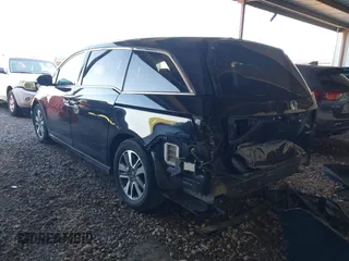 2014 Honda Odyssey Touring with VIN 5FNRL5H94EB110590, listed as a IAAI auction lot 42092929 with 242,338 mi miles and . Bid and sale history available at DreamBid. Image 3.