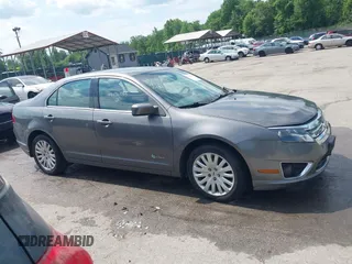 2011 Ford Fusion Hybrid with VIN 3FADP0L32BR132155, listed as a IAAI auction lot 42196233 with 77,900 mi miles and . Bid and sale history available at DreamBid. Image 13.