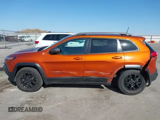 2016 Jeep Cherokee Trailhawk with VIN 1C4PJMBBXGW251682, listed as a IAAI auction lot 41973696 with 100,411 mi miles. Bid and sale history available at carsss.com. Image 15.
