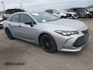 2022 Toyota Avalon Hybrid XSE Nightshade with VIN 4T1EA1AB2NU013126, listed as a IAAI auction lot 40991091 with 86,681 mi miles and . Bid and sale history available at DreamBid. Image 1.