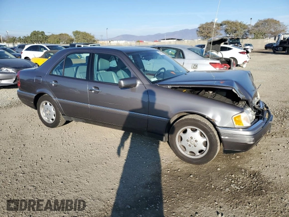 1997 Mercedes-Benz C with VIN WDBHA23E7VF545229, listed as a Copart auction lot 43518335 with 153,158 mi miles and Salvage title. Bid and sale history available at DreamBid. Image 4.