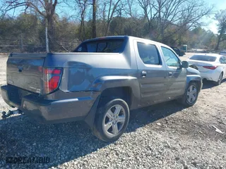 2014 Honda Ridgeline RTL with VIN 5FPYK1F52EB002984, listed as a IAAI auction lot 41347361 with 162,015 mi miles. Bid and sale history available at carsss.com. Image 4.