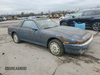 1986 Toyota Supra z VIN JT2MA70L5G0019616, wystawiony jako Copart lot #85307554 z przebiegiem 33 961 mil mil oraz Czysty tytuł • Clean title. Historia ofert i sprzedaży dostępna na DreamBid. Obrazek 4.