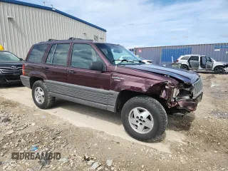 1994 Jeep Grand Cherokee Laredo z VIN 1J4GZ58S0RC221854, wystawiony jako Copart lot #61950825 z przebiegiem 69 465 mil mil oraz Czysty tytuł • Clean title. Historia ofert i sprzedaży dostępna na DreamBid. Obrazek 4.