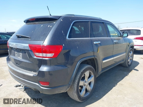 2013 Jeep Grand Cherokee Overland with VIN 1C4RJECT8DC534021, listed as a IAAI auction lot 42058374 with 137,289 mi miles. Bid and sale history available at carsss.com. Image 4.