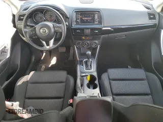 2014 Mazda CX-5 Touring z VIN JM3KE2CY0E0412733, wystawiony jako Copart lot #55803865 z przebiegiem 161 539 mil mil oraz Szkoda całkowita • Salvage title. Historia ofert i sprzedaży dostępna na DreamBid. Obrazek 8.