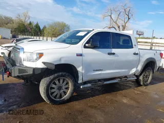 2012 Toyota Tundra 4WD Truck with VIN 5TFDW5F10CX241968, listed as a IAAI auction lot 41858300 with 272,634 mi miles. Bid and sale history available at carsss.com. Image 14.