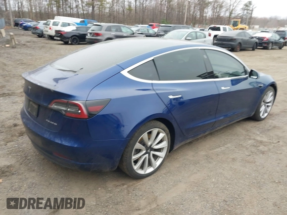 2019 Tesla Model 3 Long Range with VIN 5YJ3E1EB9KF454007, listed as a IAAI auction lot 41769346 with 141,609 mi miles. Bid and sale history available at carsss.com. Image 4.