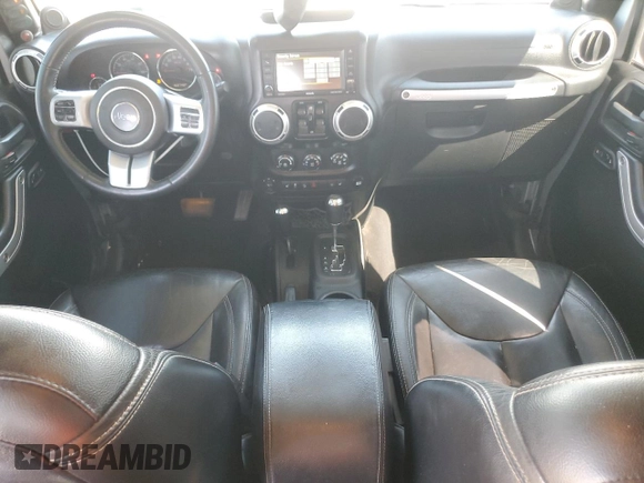 2014 Jeep Wrangler Unlimited Rubicon X with VIN 1C4BJWFG2EL308077, listed as a Copart auction lot 54439265 with 160,746 mi miles and Salvage title. Bid and sale history available at DreamBid. Image 8.