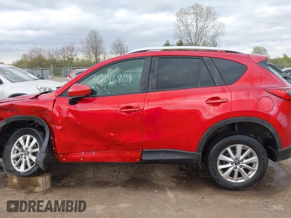 2014 Mazda CX-5 Touring z VIN JM3KE2CY3E0424892, wystawiony jako IAAI lot #42016801 z przebiegiem 173 350 mil mil oraz . Historia ofert i sprzedaży dostępna na DreamBid. Obrazek 14.