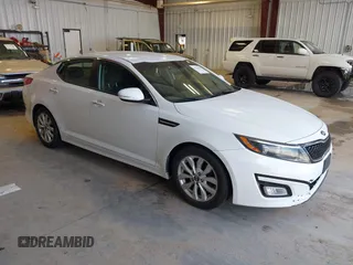 2015 Kia Optima LX with VIN KNAGM4A79F5616665, listed as a IAAI auction lot 42121526 with 153,022 mi miles. Bid and sale history available at carsss.com. Image 1.