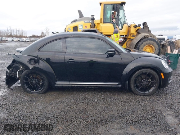 2014 Volkswagen Beetle 2.5L w/Sun with VIN 3VWJP7AT3EM608906, listed as a IAAI auction lot 41501830 with 42,804 mi miles and . Bid and sale history available at DreamBid. Image 13.