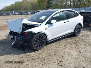 2022 Tesla Model X Plaid z VIN 7SAXCBE6XNF340704, wystawiony jako IAAI lot #41928524 z przebiegiem Nie podano mil oraz . Historia ofert i sprzedaży dostępna na DreamBid. Obrazek 19.