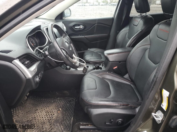 2015 Jeep Cherokee Trailhawk with VIN 1C4PJMBSXFW709977, listed as a Copart auction lot 79453984 with 61,893 mi miles and Salvage Title. Bid and sale history available at carsss.com. Image 7.