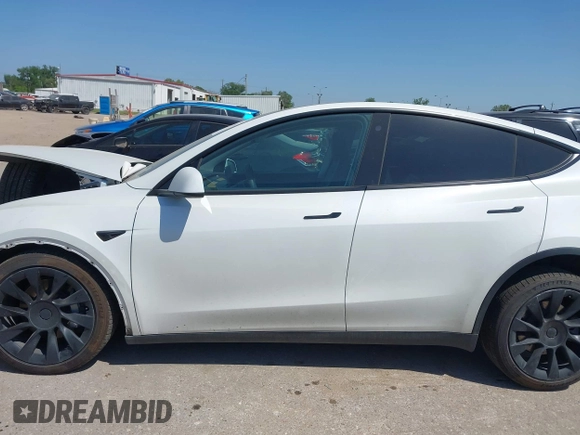 2021 Tesla Model Y Long Range with VIN 5YJYGDEE0MF265339, listed as a IAAI auction lot 41975058 with 51,292 mi miles and . Bid and sale history available at DreamBid. Image 14.