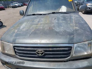 1999 Toyota Land Cruiser z VIN JT3HT05JXX0060572, wystawiony jako IAAI lot #42489190 z przebiegiem 253 014 mil mil oraz . Historia ofert i sprzedaży dostępna na DreamBid. Obrazek 6.