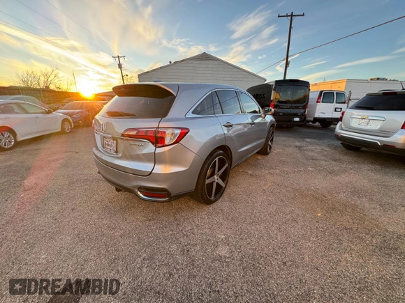 2018 Acura RDX Technology with VIN 5J8TB3H50JL010568, listed as a Copart auction lot 87761635 with 129,034 mi miles and Clean Title. Bid and sale history available at DreamBid. Image 4.