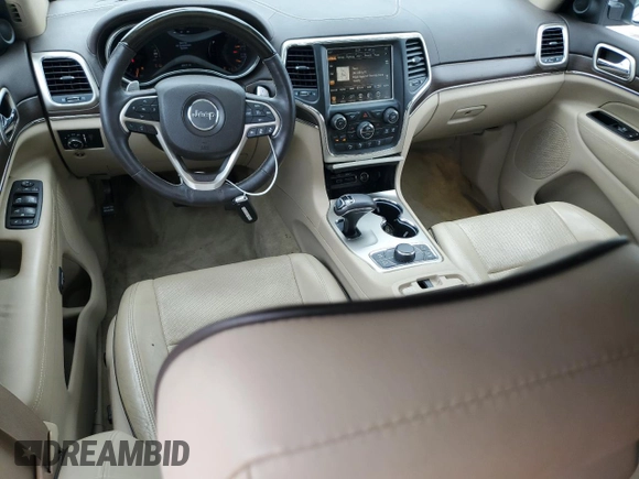 2015 Jeep Grand Cherokee Overland with VIN 1C4RJFCGXFC891616, listed as a Copart auction lot 61386065 with 90,011 mi miles and Salvage title. Bid and sale history available at DreamBid. Image 8.
