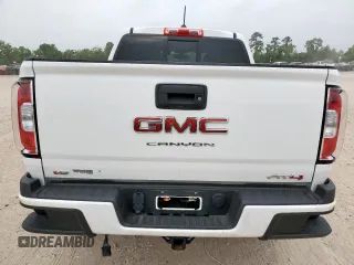 2022 GMC Canyon 4WD AT4 z VIN 1GTG6FEN2N1210072, wystawiony jako Copart lot #57084565 z przebiegiem 64 897 mil mil oraz Szkoda całkowita • Salvage title. Historia ofert i sprzedaży dostępna na DreamBid. Obrazek 6.