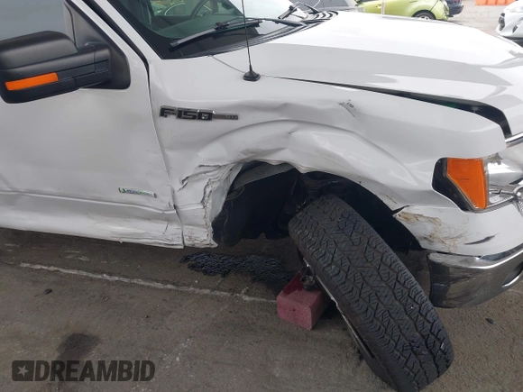 2014 Ford F-150 XL with VIN 1FTFW1CT1EKE22892, listed as a IAAI auction lot 42172851 with 14,203 mi miles and . Bid and sale history available at DreamBid. Image 6.