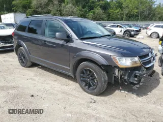 2017 Dodge Journey SXT with VIN 3C4PDDBG9HT639285, listed as a Copart auction lot 58600005 with 124,887 mi miles and Salvage title. Bid and sale history available at DreamBid. Image 4.