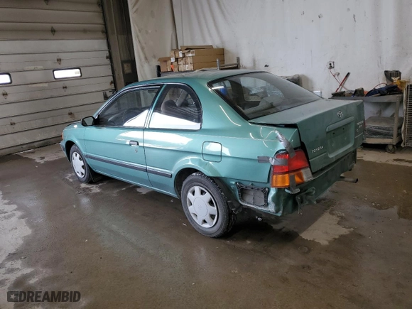 1995 Toyota Tercel DX with VIN JT2EL56D9S0031098, listed as a Copart auction lot 42008395 with 115,102 mi miles and Salvage Title. Bid and sale history available at carsss.com. Image 2.