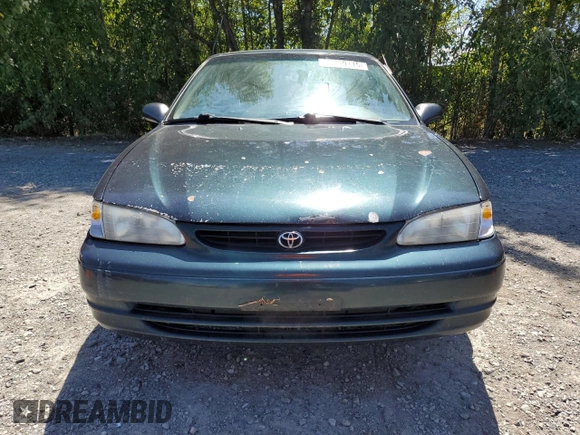 1999 Toyota Corolla VE with VIN 1NXBR12E7XZ240321, listed as a Copart auction lot 64259115 with 144,145 mi miles and Salvage title. Bid and sale history available at DreamBid. Image 5.