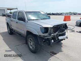 2014 Toyota Tacoma PreRunner z VIN 3TMJU4GN1EM173354, wystawiony jako IAAI lot #42021686 z przebiegiem 101 138 mil mil oraz . Historia ofert i sprzedaży dostępna na DreamBid. Obrazek 1.