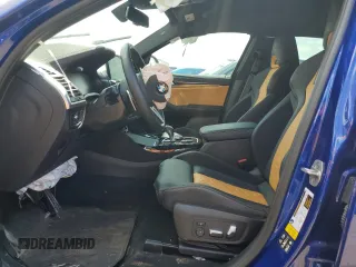 2022 BMW X4 M z VIN 5YM23EC05N9K69338, wystawiony jako Copart lot #63157463 z przebiegiem Nie podano mil oraz . Historia ofert i sprzedaży dostępna na DreamBid. Obrazek 7.