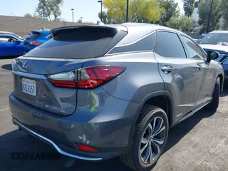 2022 Lexus RX 450h with VIN 2T2HGMDA4NC077617, listed as a IAAI auction lot 42489655 with 37,683 mi miles and . Bid and sale history available at DreamBid. Image 4.