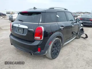 2019 MINI Countryman Cooper S with VIN WMZYT5C58K3E64351, listed as a IAAI auction lot 41739265 with 58,893 mi miles. Bid and sale history available at carsss.com. Image 4.